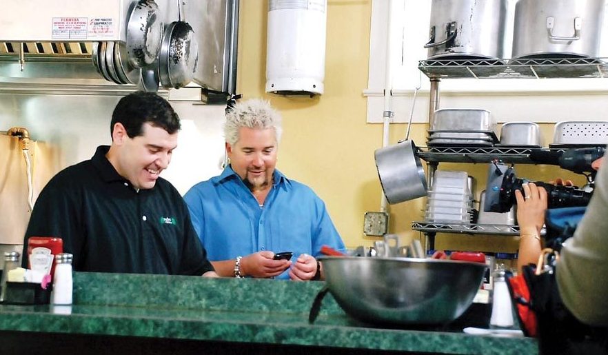 Guy Fieri in the kitchen of Metro Diner