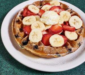 Metro Diner Fruity waffle with blueberries strawberries banana butter powdered sugar