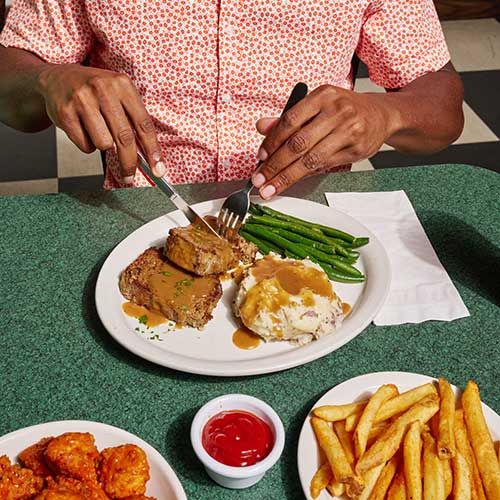 meatloaf cut with boneless wings and french fries