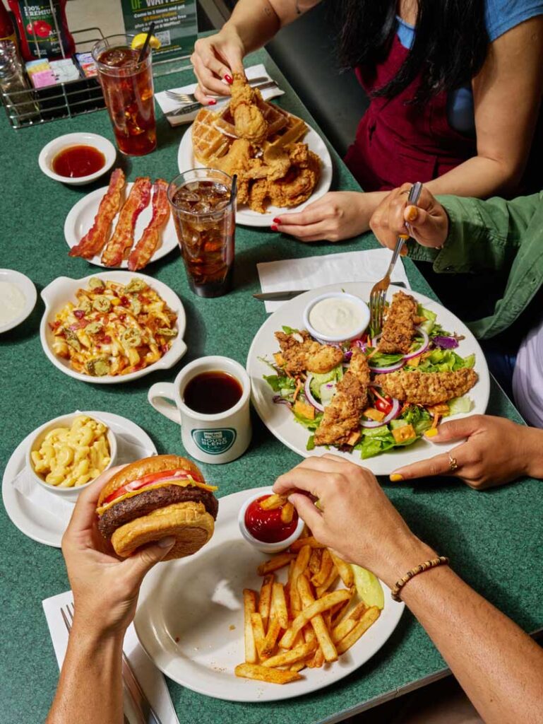 table spread burger chicken and waffles chicken tender salad