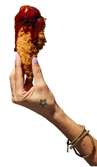 hand holding BBQ Chicken tender
