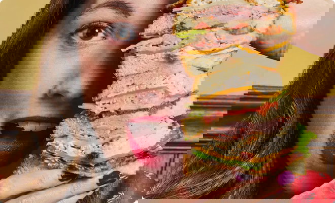 Girl holding sandwich